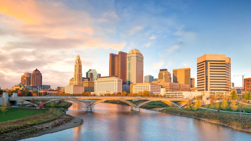 View of downtown Columbus Ohio skyline at sunset.