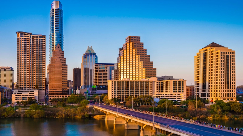 Austin Texas cityscape skyline panorama, Congress Avenue Bridge in late afternoon.